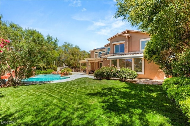 2940 Cimini Ct, Henderson, NV 89052 - back of property featuring a pergola, a lawn, an outdoor pool, a patio, and stucco siding