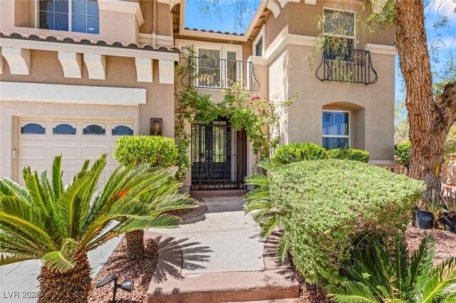 2940 Cimini Ct, Henderson, NV 89052 - view of front facade featuring stucco siding, a balcony, and an attached garage