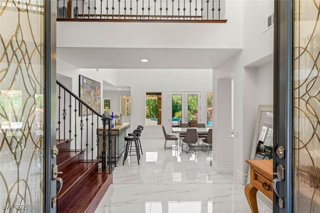 2940 Cimini Ct, Henderson, NV 89052 - foyer with baseboards, stairway, a high ceiling, french doors, and marble finish flooring