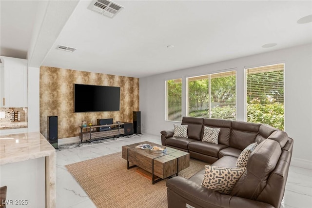 2940 Cimini Ct, Henderson, NV 89052 - living room featuring light marble finish floors, baseboards, and an accent wall