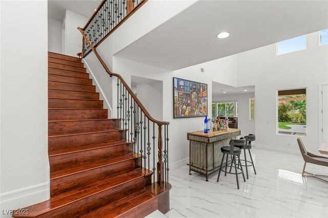 2940 Cimini Ct, Henderson, NV 89052 - stairway with marble finish floors, baseboards, recessed lighting, and a high ceiling