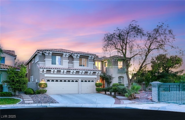 2940 Cimini Ct, Henderson, NV 89052 - mediterranean / spanish-style home featuring stucco siding, concrete driveway, fence, a garage, and a tile roof