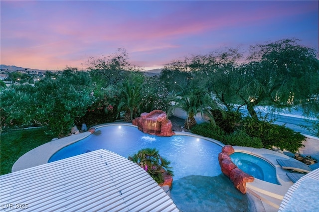 2940 Cimini Ct, Henderson, NV 89052 - pool at dusk featuring a pool with connected hot tub