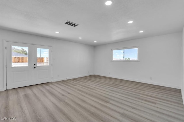 4186 Toronto Cir, Las Vegas, NV 89121 - spare room featuring french doors, light wood-style floors, recessed lighting, and baseboards