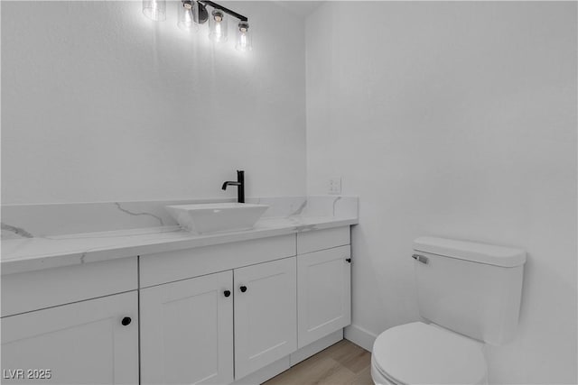 4186 Toronto Cir, Las Vegas, NV 89121 - bathroom featuring toilet, vanity, and wood finished floors