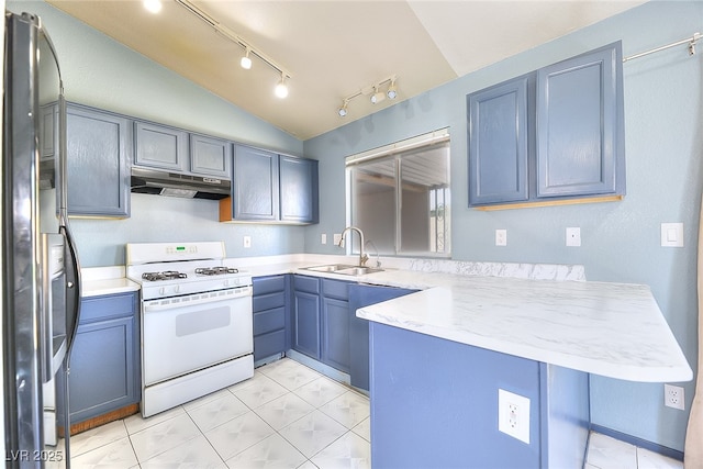 5536 Cleary Ct, Las Vegas, NV 89108 - kitchen featuring white gas range, under cabinet range hood, a sink, a peninsula, and stainless steel refrigerator with ice dispenser