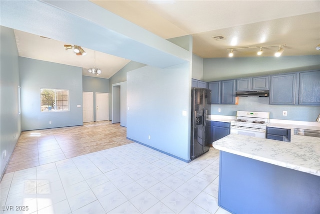 5536 Cleary Ct, Las Vegas, NV 89108 - kitchen with white range with gas cooktop, under cabinet range hood, a sink, black fridge with ice dispenser, and lofted ceiling