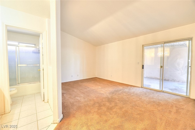 5536 Cleary Ct, Las Vegas, NV 89108 - empty room with lofted ceiling, light colored carpet, baseboards, and light tile patterned floors