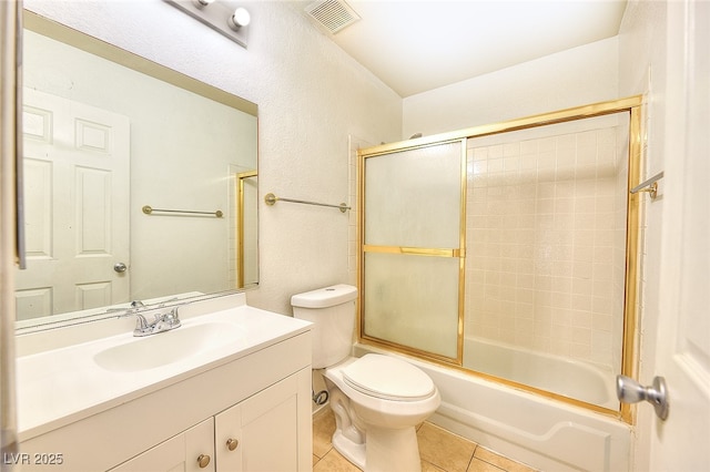 5536 Cleary Ct, Las Vegas, NV 89108 - bathroom featuring tile patterned floors, vanity, toilet, and combined bath / shower with glass door
