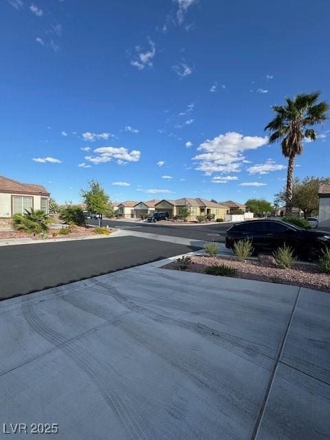 8325 Aspen Village St, Las Vegas, NV 89113 - view of asphalt street featuring a residential view