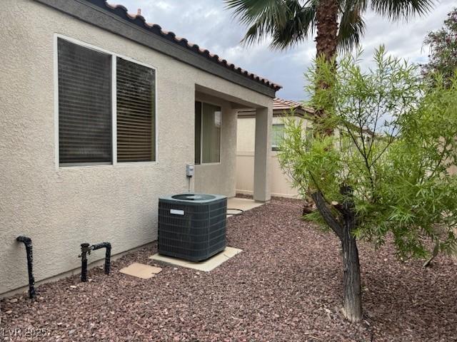 8325 Aspen Village St, Las Vegas, NV 89113 - view of side of home featuring stucco siding and a tiled roof