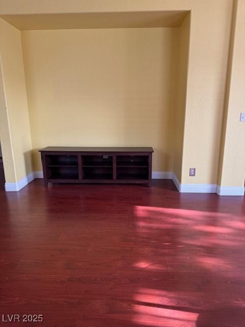mudroom with wood finished floors and baseboards