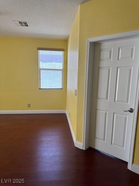 8325 Aspen Village St, Las Vegas, NV 89113 - unfurnished room featuring dark wood-type flooring and baseboards