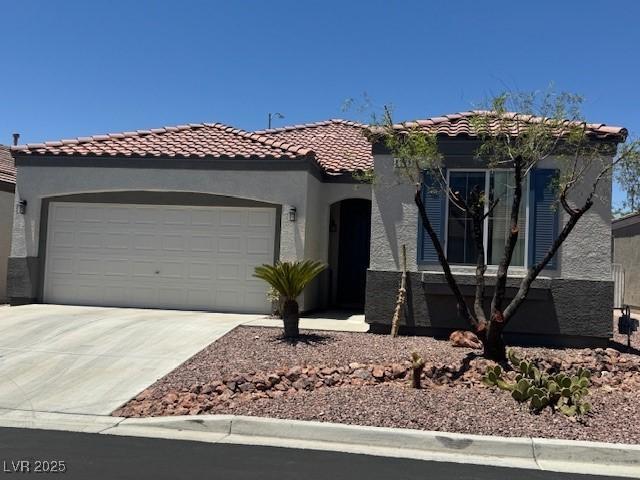 8325 Aspen Village St, Las Vegas, NV 89113 - view of front of property with concrete driveway, an attached garage, stucco siding, and a tile roof