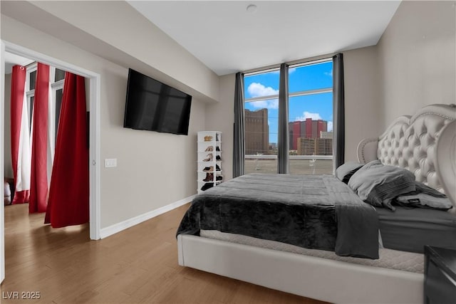 200 W Sahara Ave Unit 603, Las Vegas, NV 89102 - bedroom featuring wood finished floors and baseboards