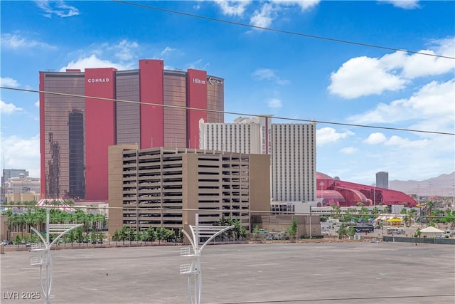 200 W Sahara Ave Unit 603, Las Vegas, NV 89102 - view of building exterior with a city view and a mountain view
