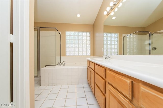 8205 Harrogate Ave, Las Vegas, NV 89129 - full bath featuring a shower stall, a garden tub, tile patterned floors, and double vanity