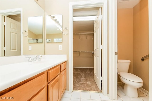 8205 Harrogate Ave, Las Vegas, NV 89129 - bathroom with toilet, vanity, tile patterned flooring, and baseboards