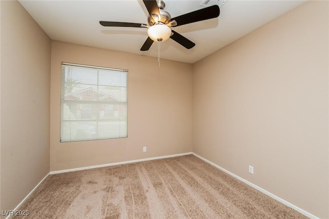 8205 Harrogate Ave, Las Vegas, NV 89129 - unfurnished room with light colored carpet, baseboards, and ceiling fan