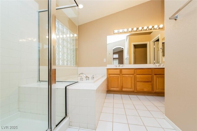 8205 Harrogate Ave, Las Vegas, NV 89129 - full bath with a bath, tiled shower, tile patterned floors, and double vanity