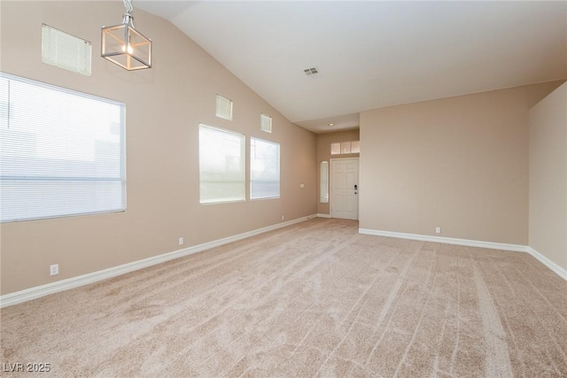 8205 Harrogate Ave, Las Vegas, NV 89129 - spare room with light carpet, baseboards, and high vaulted ceiling