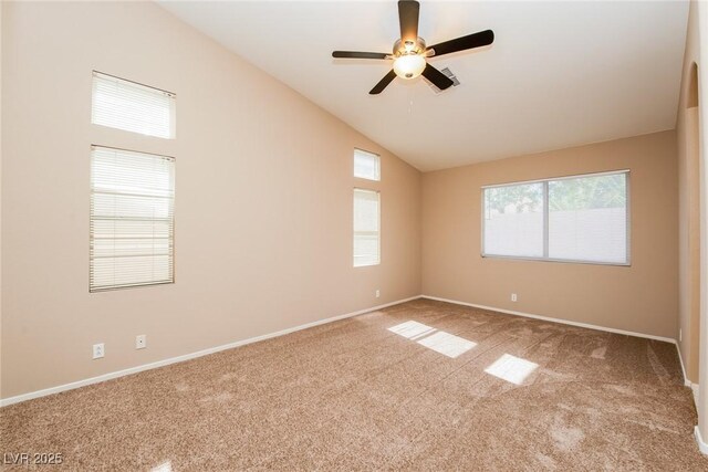 8205 Harrogate Ave, Las Vegas, NV 89129 - spare room featuring vaulted ceiling, carpet flooring, a ceiling fan, and baseboards