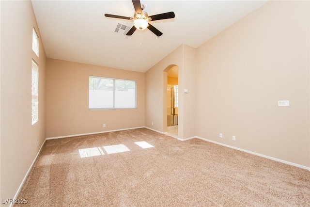 8205 Harrogate Ave, Las Vegas, NV 89129 - carpeted empty room featuring arched walkways, a ceiling fan, lofted ceiling, and baseboards