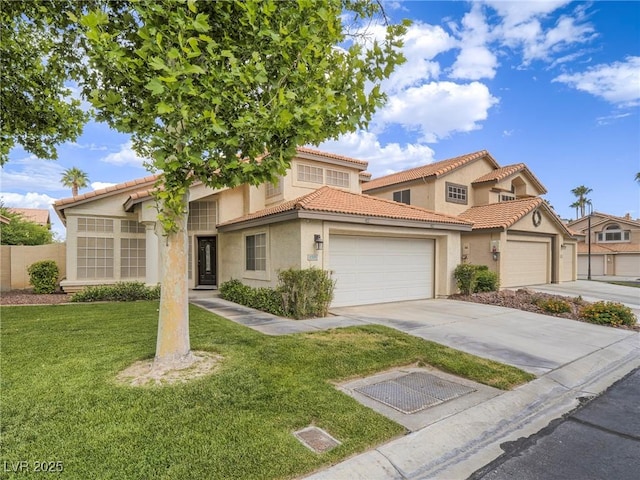 5452 Big Sky Ln, Las Vegas, NV 89149 - mediterranean / spanish-style home featuring an attached garage, driveway, stucco siding, and a front lawn