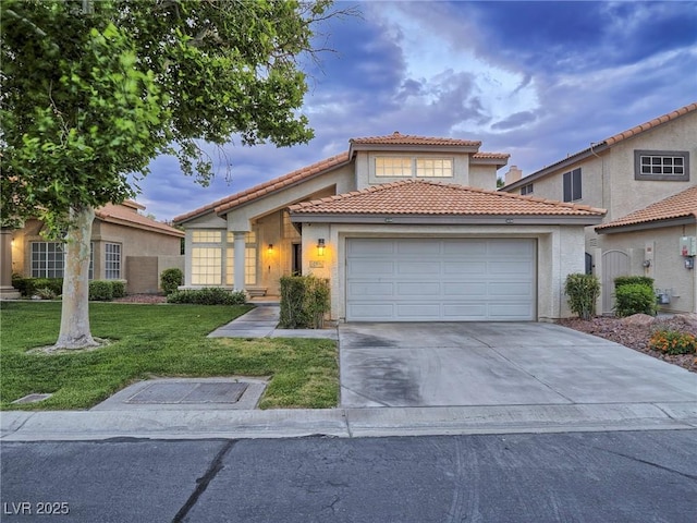 5452 Big Sky Ln, Las Vegas, NV 89149 - mediterranean / spanish-style house with a garage, a tiled roof, a front lawn, concrete driveway, and stucco siding