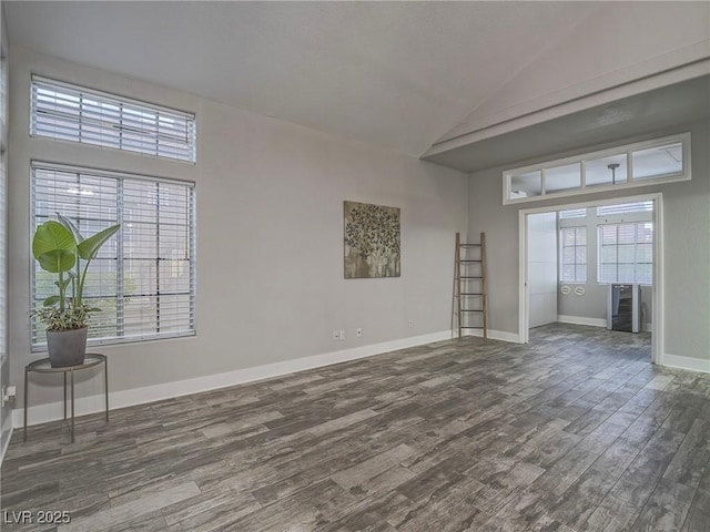 5452 Big Sky Ln, Las Vegas, NV 89149 - spare room with wood finished floors, baseboards, and high vaulted ceiling