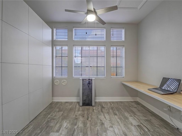 5452 Big Sky Ln, Las Vegas, NV 89149 - unfurnished office with plenty of natural light, wood finished floors, baseboards, and a ceiling fan