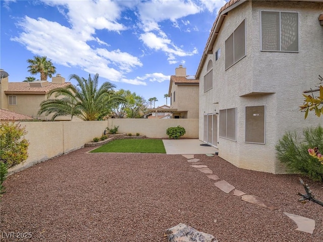 5452 Big Sky Ln, Las Vegas, NV 89149 - fenced backyard featuring a patio