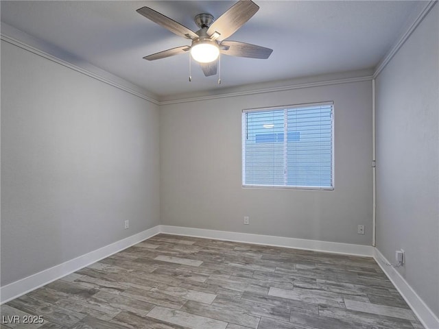 5452 Big Sky Ln, Las Vegas, NV 89149 - empty room with ceiling fan, wood finished floors, baseboards, and ornamental molding