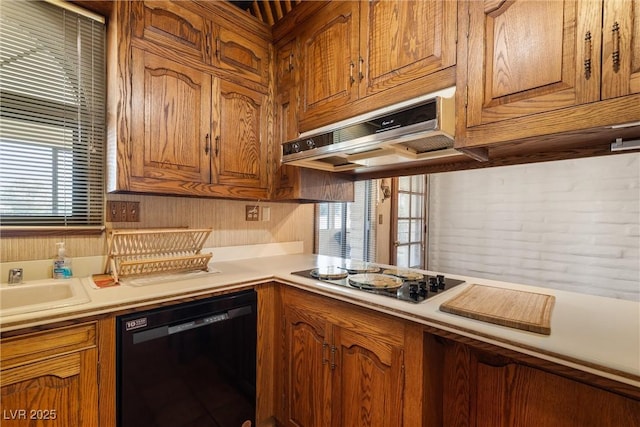 1320 Daytona St, Pahrump, NV 89048 - kitchen featuring black dishwasher, stovetop, light countertops, and brown cabinets