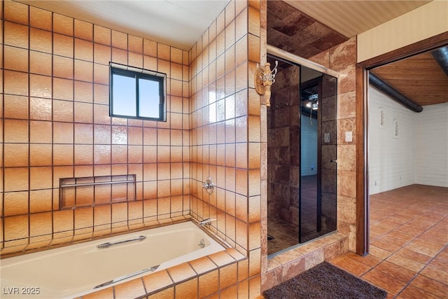 1320 Daytona St, Pahrump, NV 89048 - bathroom with tiled shower, tiled bath, and tile patterned floors