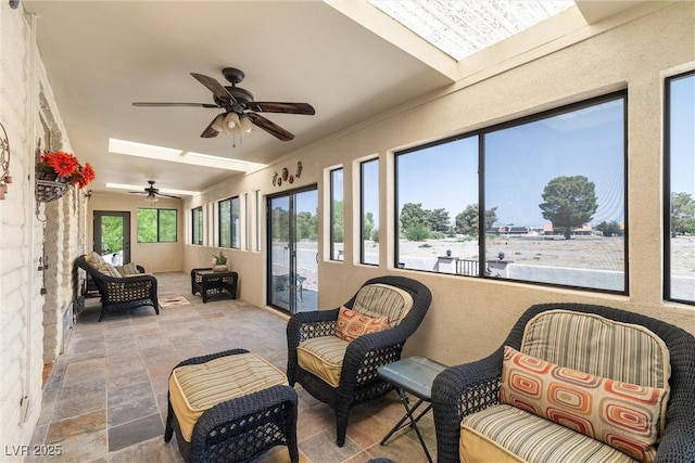 1320 Daytona St, Pahrump, NV 89048 - sunroom with ceiling fan, stone finish floors, an outdoor hangout area, and french doors