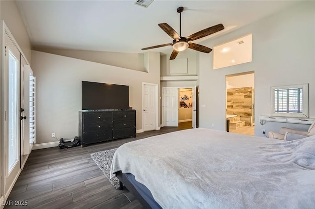 5638 Wild Olive St, Las Vegas, NV 89118 - bedroom with high vaulted ceiling, dark wood-style floors, baseboards, a ceiling fan, and ensuite bathroom