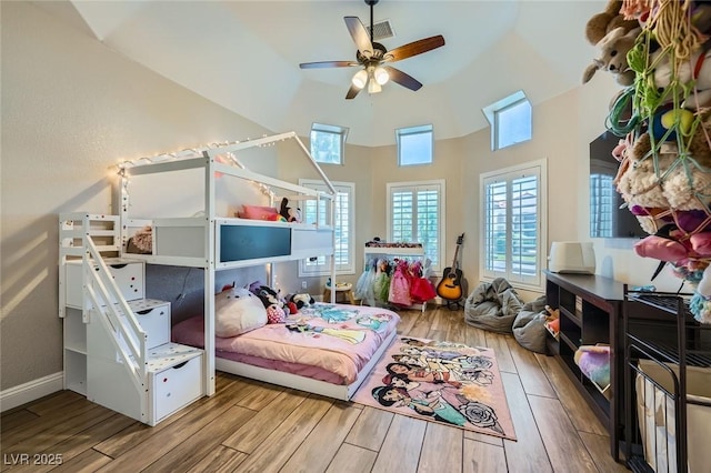 5638 Wild Olive St, Las Vegas, NV 89118 - bedroom with wood finished floors, a towering ceiling, and a ceiling fan