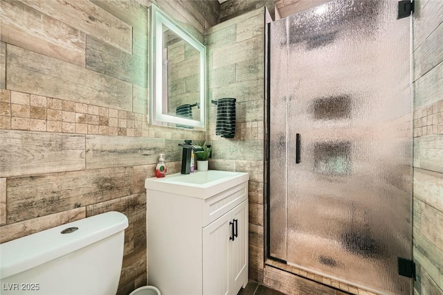 5638 Wild Olive St, Las Vegas, NV 89118 - bathroom featuring a stall shower, toilet, and vanity