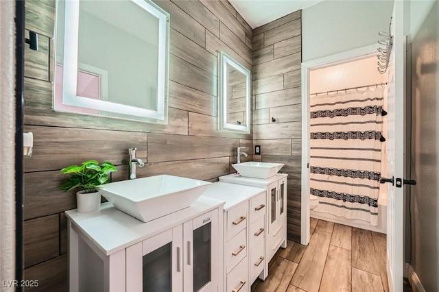 5638 Wild Olive St, Las Vegas, NV 89118 - full bath featuring double vanity, wood walls, wood finished floors, and toilet