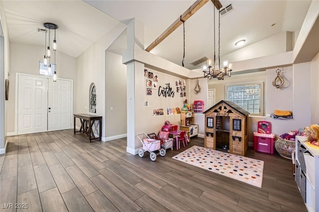 5638 Wild Olive St, Las Vegas, NV 89118 - rec room with a chandelier, wood finished floors, high vaulted ceiling, and baseboards