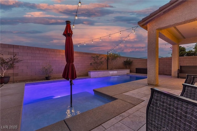 view of pool with a fenced backyard, a patio, and a hot tub