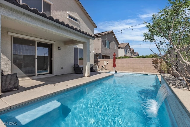 view of pool with a patio area and a fenced backyard