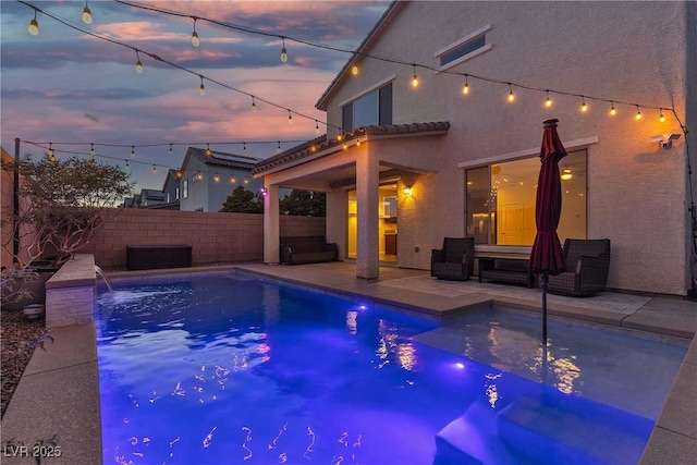 view of pool with a patio area and a fenced backyard