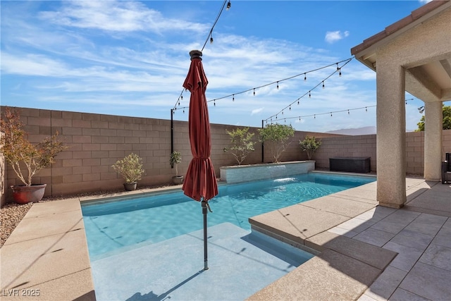 view of pool featuring a fenced backyard and a patio
