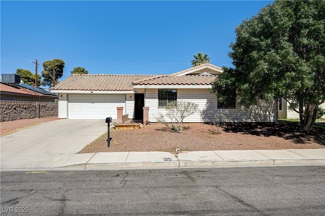 1620 Yellow Rose St, Las Vegas, NV 89108 - ranch-style home featuring a tile roof, a garage, driveway, and central AC unit