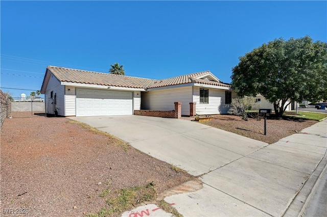 1620 Yellow Rose St, Las Vegas, NV 89108 - view of front of house with an attached garage, driveway, fence, and brick siding