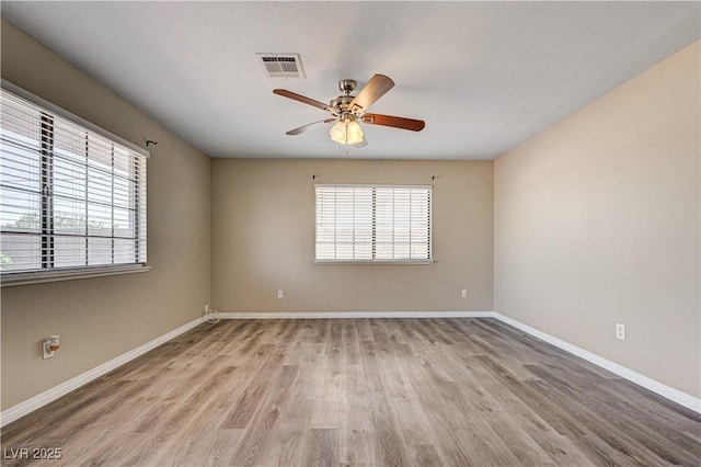 1620 Yellow Rose St, Las Vegas, NV 89108 - spare room with wood finished floors, ceiling fan, and baseboards