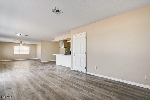 1620 Yellow Rose St, Las Vegas, NV 89108 - unfurnished living room with baseboards, dark wood-style floors, and ceiling fan