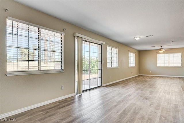 1620 Yellow Rose St, Las Vegas, NV 89108 - unfurnished room with wood finished floors, baseboards, and a ceiling fan